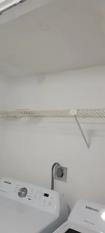 a view of backyard with outdoor seating and city view