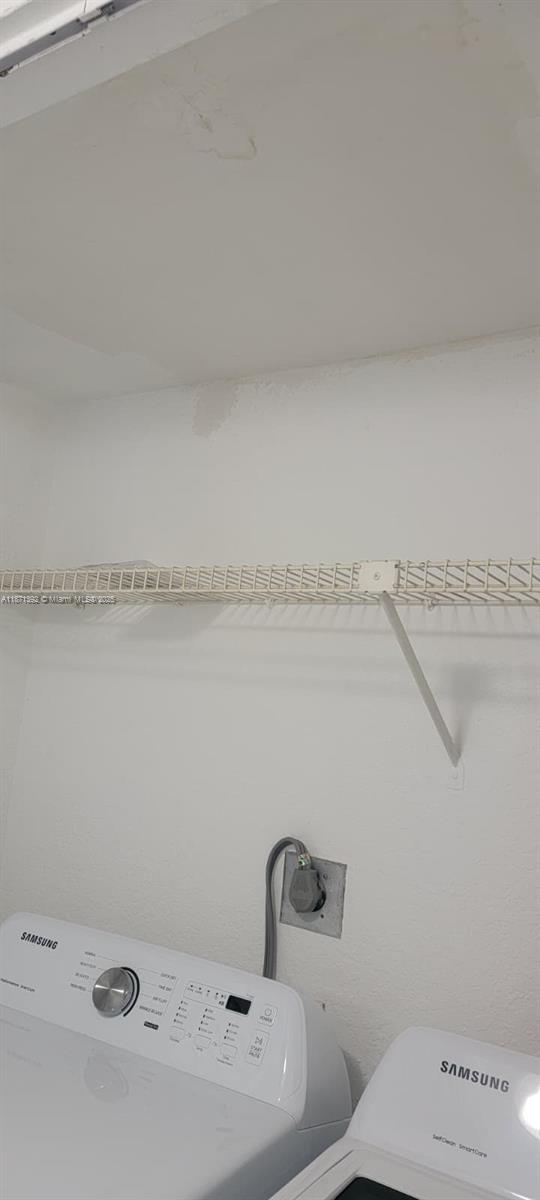 8323 Lake Drive, Unit 404 Doral, FL 33166 - Photo 9 of 11 a bathroom with a toilet and a sink