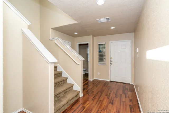 a view of entryway with wooden floor