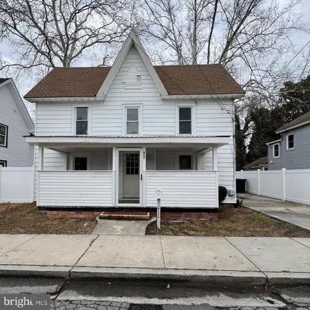 a front view of a house with garage