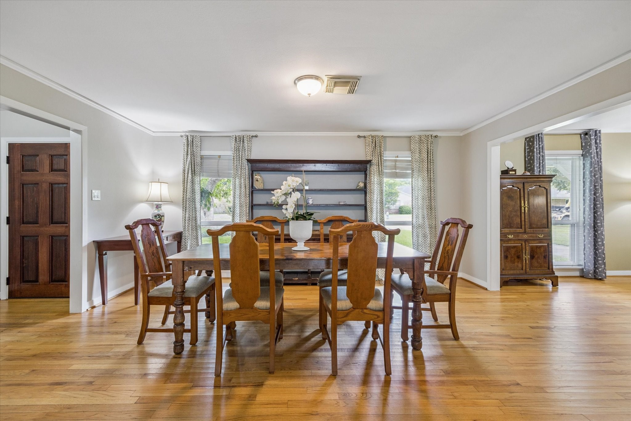 a view of a dining room with furniture window and wooden floor