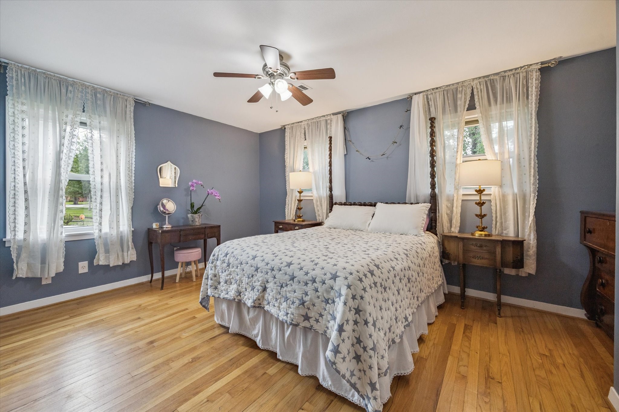 5114 Kinglet Street Houston, TX 77035 - Photo 12 of 20 a bedroom with a bed chandelier and a window