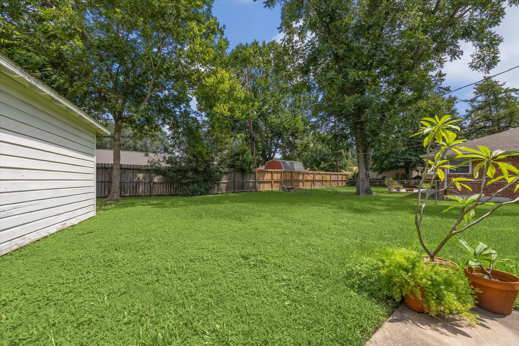 5114 Kinglet Street Houston, TX 77035 - Photo 19 of 20 a view of a backyard with a garden