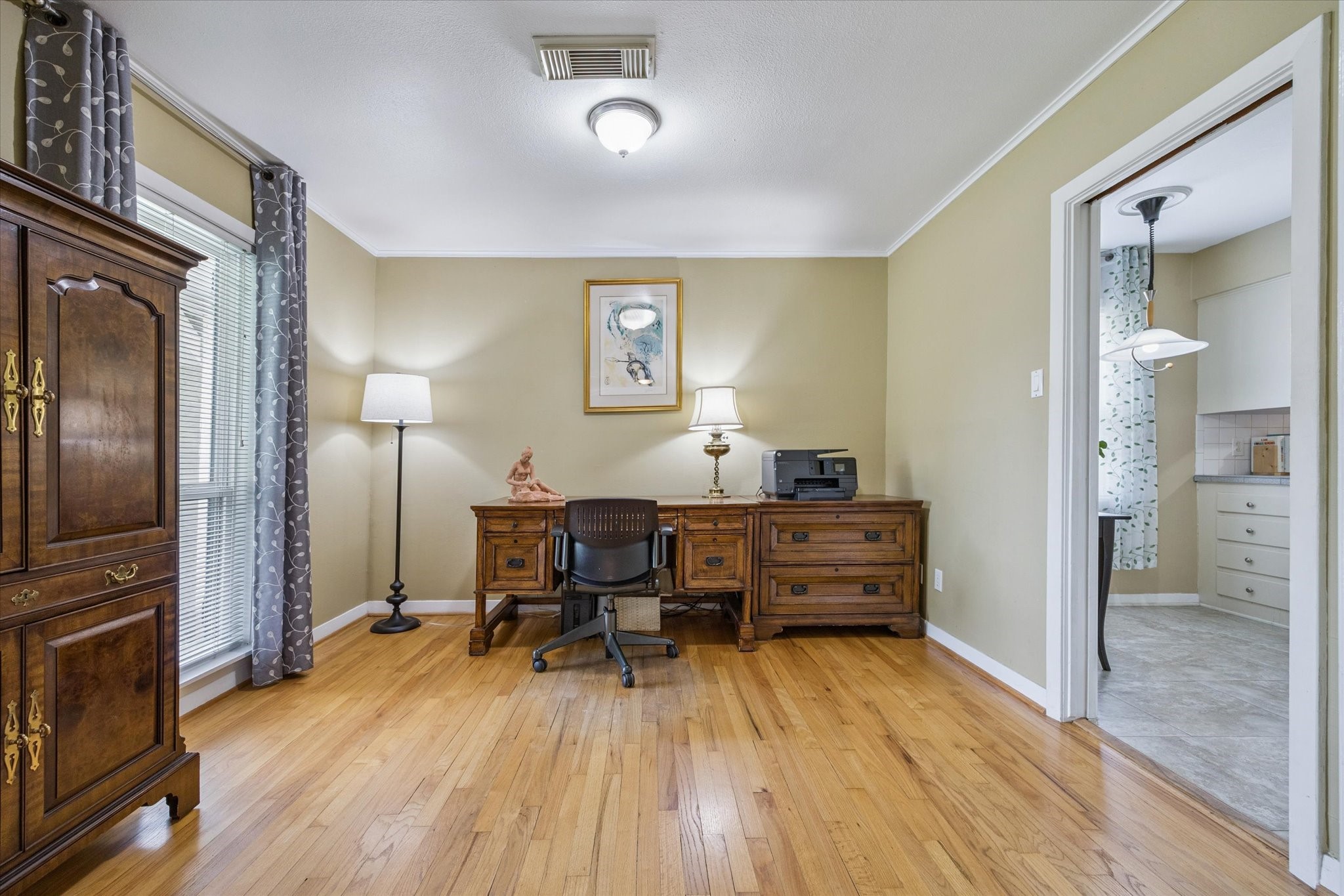 5114 Kinglet Street Houston, TX 77035 - Photo 6 of 20 a view of a workspace with furniture and wooden floor