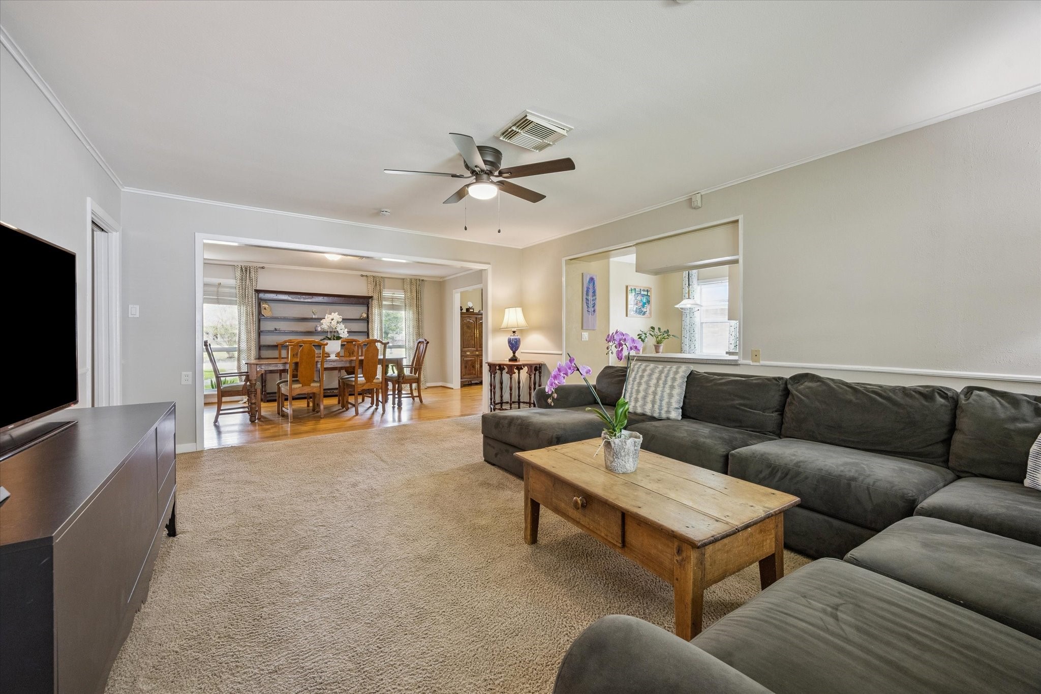 5114 Kinglet Street Houston, TX 77035 - Photo 7 of 20 a living room with furniture and a flat screen tv