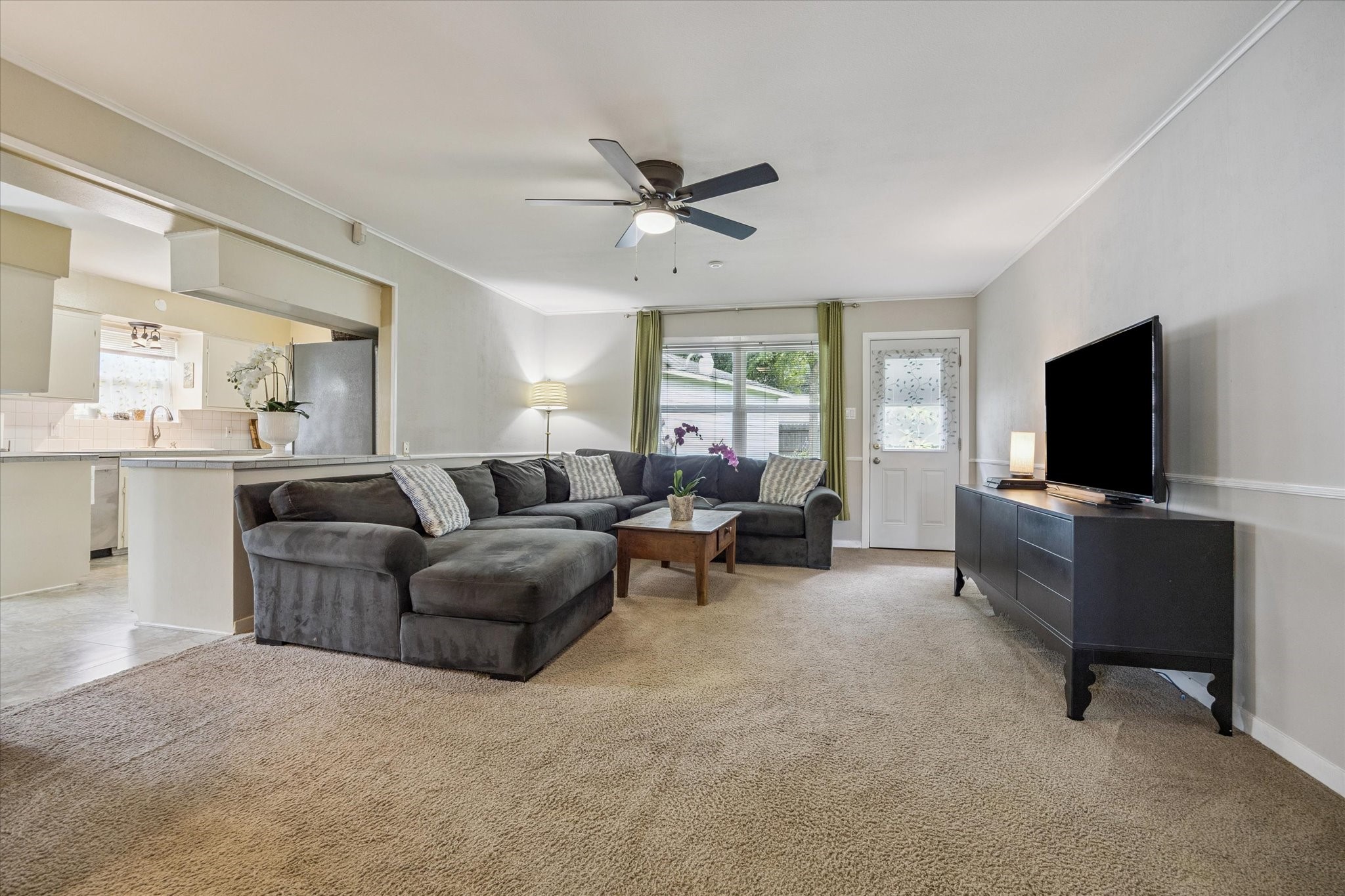 5114 Kinglet Street Houston, TX 77035 - Photo 8 of 20 a living room with furniture and a flat screen tv