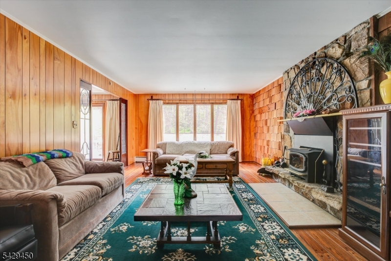 49 Frog Hollow Road Califon, NJ 07830 - Photo 3 of 28 a living room with furniture large window and a fireplace