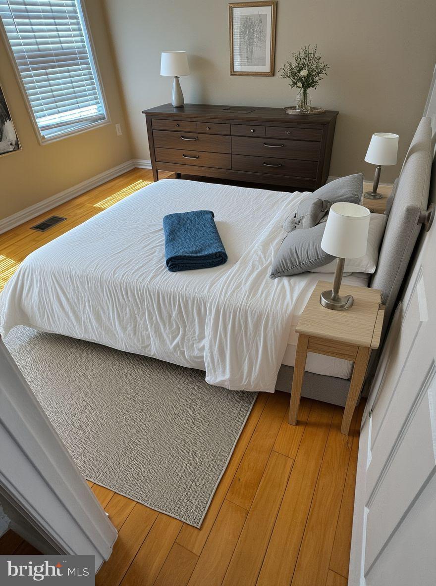 2239 Ridge Place Southeast Washington, DC 20020 - Photo 17 of 44 a bedroom with a bed and a window