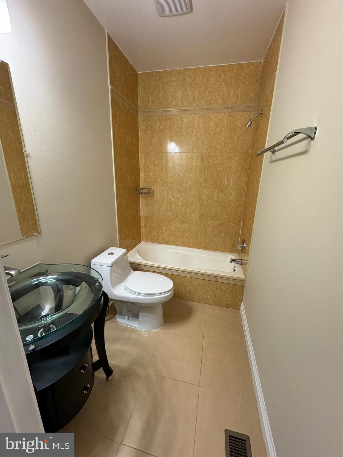 2239 Ridge Place Southeast Washington, DC 20020 - Photo 20 of 44 a bathroom with a sink a toilet and a mirror