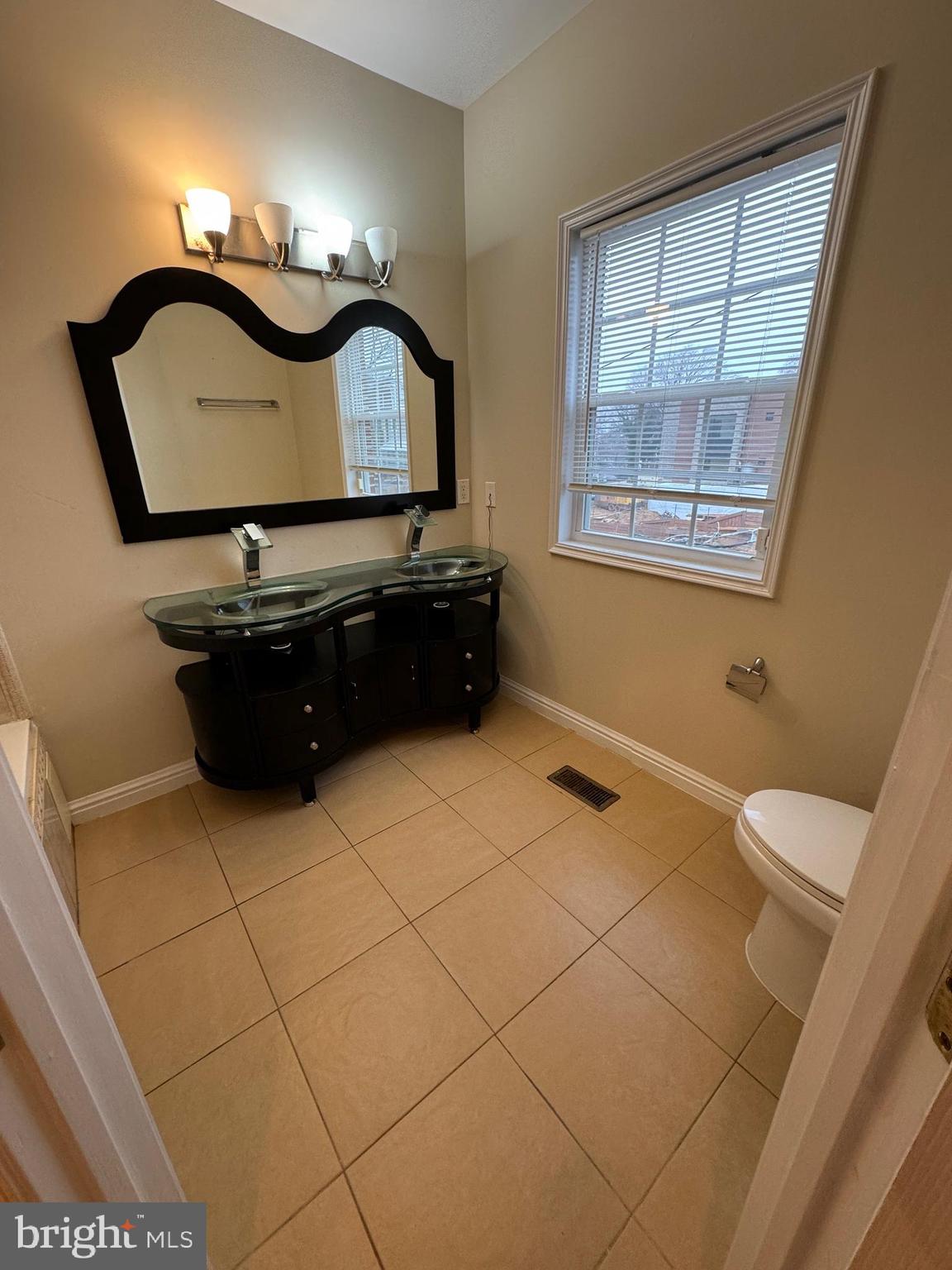 2239 Ridge Place Southeast Washington, DC 20020 - Photo 23 of 44 a bathroom with a sink and a mirror