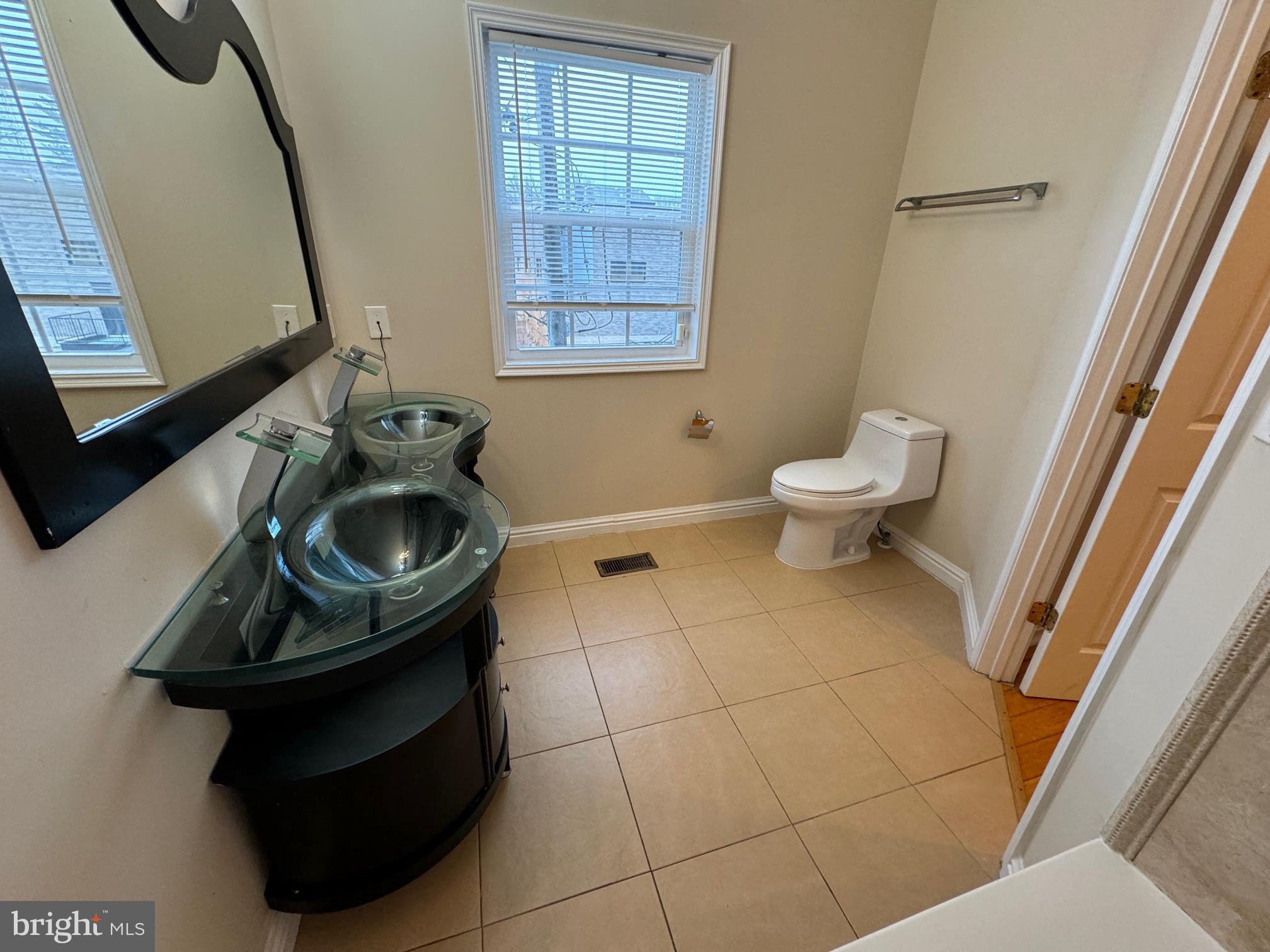 2239 Ridge Place Southeast Washington, DC 20020 - Photo 25 of 44 a bathroom with a sink toilet and mirror