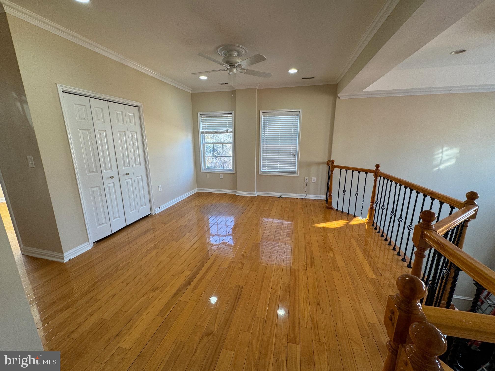 2239 Ridge Place Southeast Washington, DC 20020 - Photo 34 of 44 a view of an empty room with wooden floor and windows