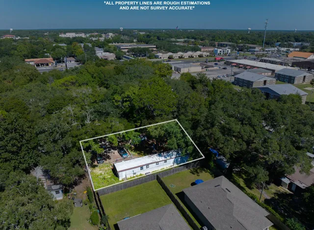 an aerial view of house with yard