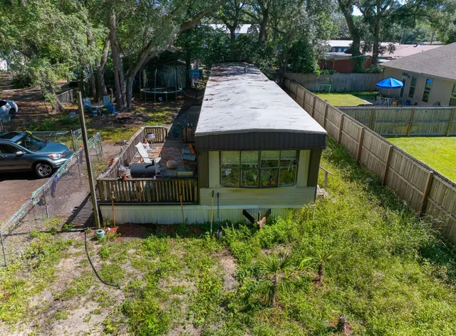a view of a backyard with plants