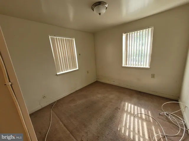 a bathroom with a toilet sink shower and mirror