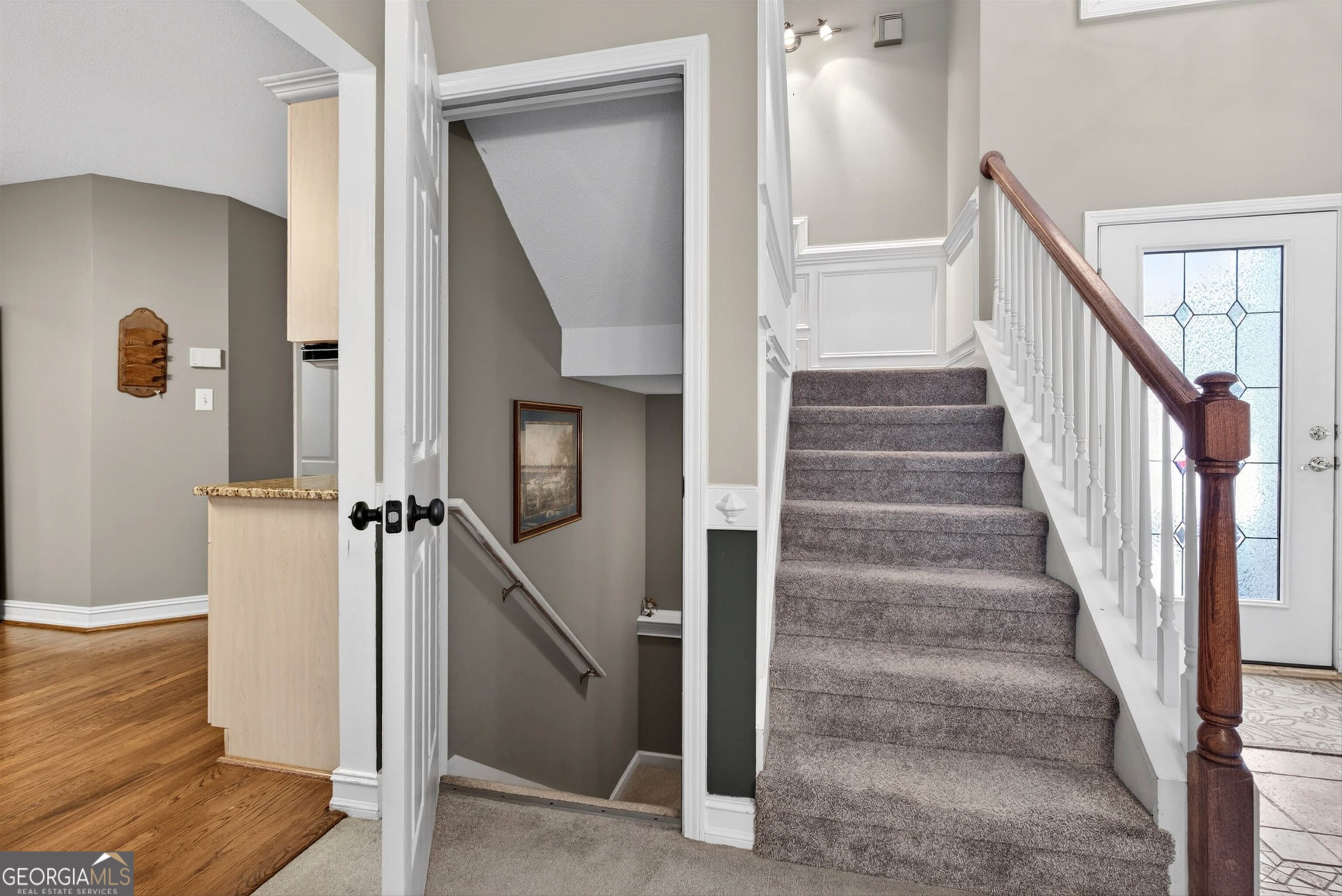101 Emerald Lane Hampton, GA 30228 - Photo 23 of 72 a view of staircase with white walls and door