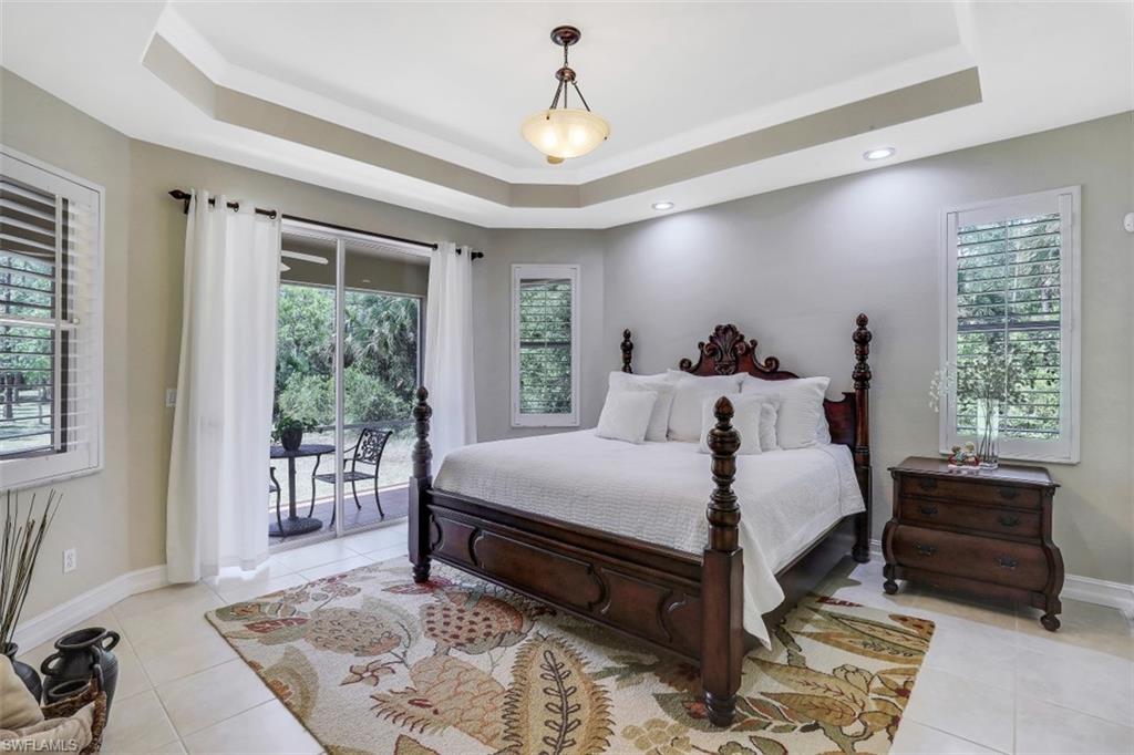 4364 6th Avenue Southeast Naples, FL 34117 - Photo 15 of 35 a bed room with a bed and a window