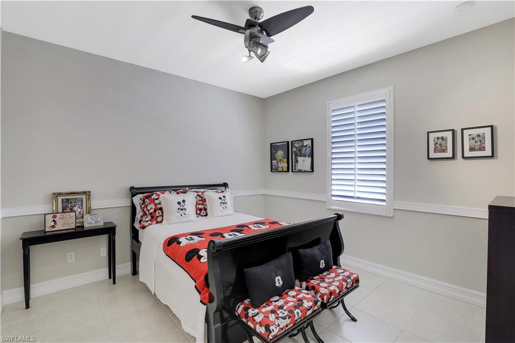 4364 6th Avenue Southeast Naples, FL 34117 - Photo 17 of 35 a bedroom with a bed and a window