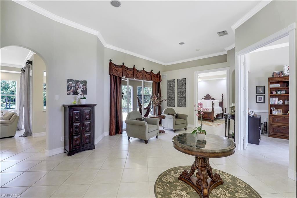 4364 6th Avenue Southeast Naples, FL 34117 - Photo 2 of 35 a view of a livingroom with furniture and a chandelier