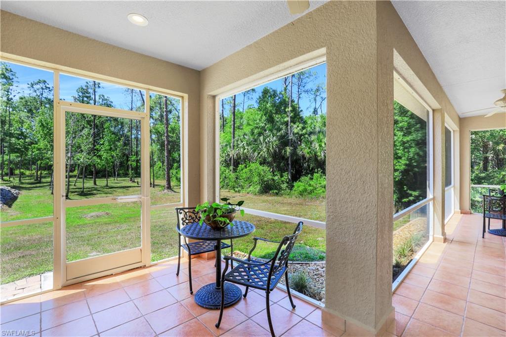 4364 6th Avenue Southeast Naples, FL 34117 - Photo 22 of 35 a view of a porch with furniture and garden
