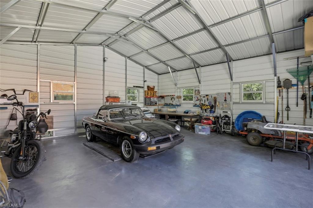 4364 6th Avenue Southeast Naples, FL 34117 - Photo 28 of 35 a car is parked in a garage