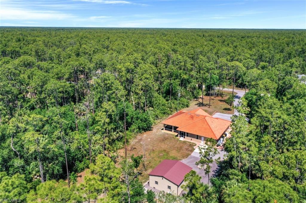 4364 6th Avenue Southeast Naples, FL 34117 - Photo 31 of 35 an aerial view of a house with a yard