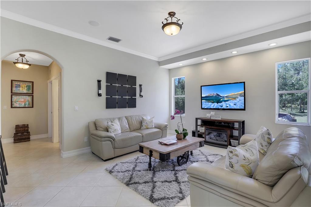 4364 6th Avenue Southeast Naples, FL 34117 - Photo 5 of 35 a living room with furniture and a flat screen tv