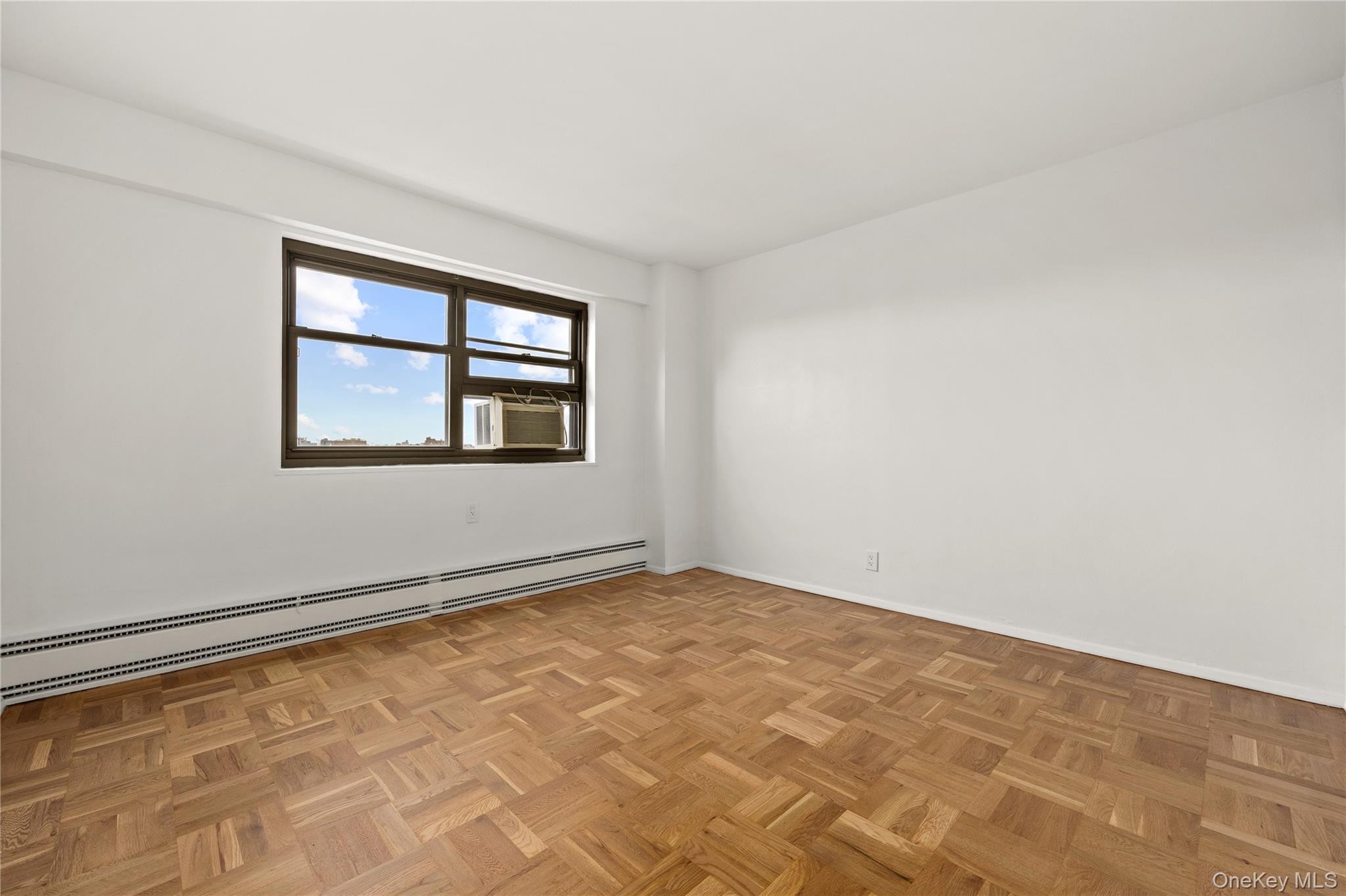 21-66 33rd Road, Unit 12B Queens, NY 11106 - Photo 15 of 23 an empty room with a window