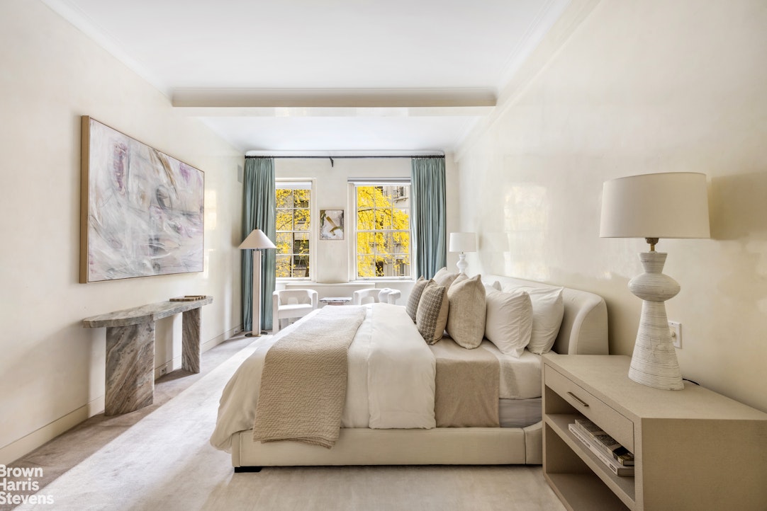 14 East 75th Street, Unit 2/3C Manhattan, NY 10021 - Photo 10 of 17 a bedroom with a bed and a night stand