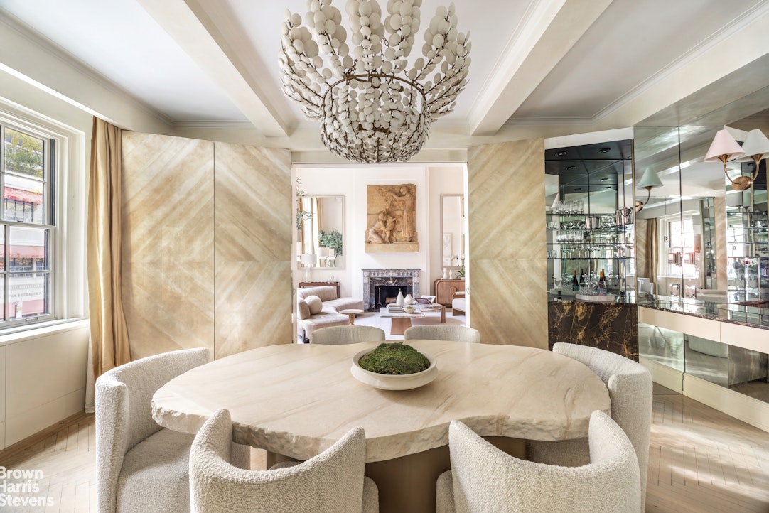 14 East 75th Street, Unit 2/3C Manhattan, NY 10021 - Photo 4 of 17 a dining room with furniture and window