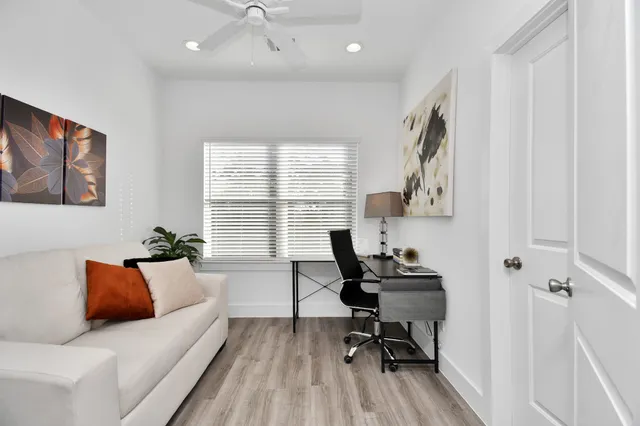 a living room with furniture and a window