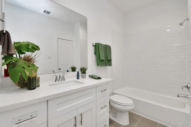 a bathroom with a sink a toilet and a bathtub