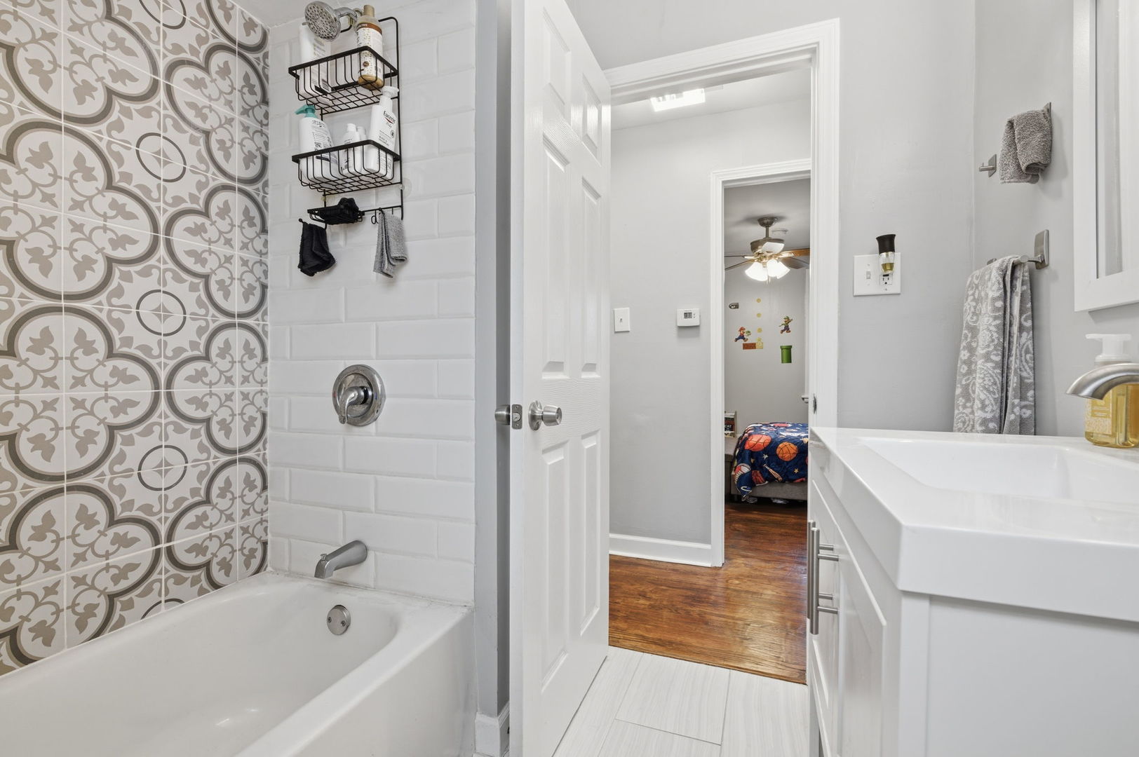 1036 West 105th Street Chicago, IL 60643 - Photo 16 of 30 a bathroom with a bathtub and a sink