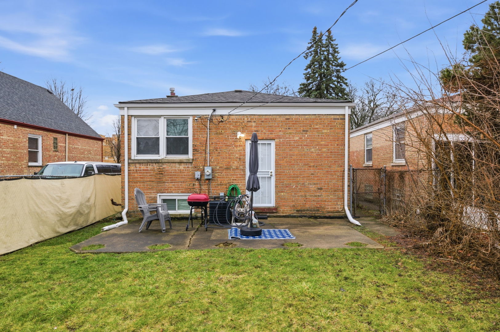 1036 West 105th Street Chicago, IL 60643 - Photo 24 of 30 a view of a patio with a chairs and table in a patio