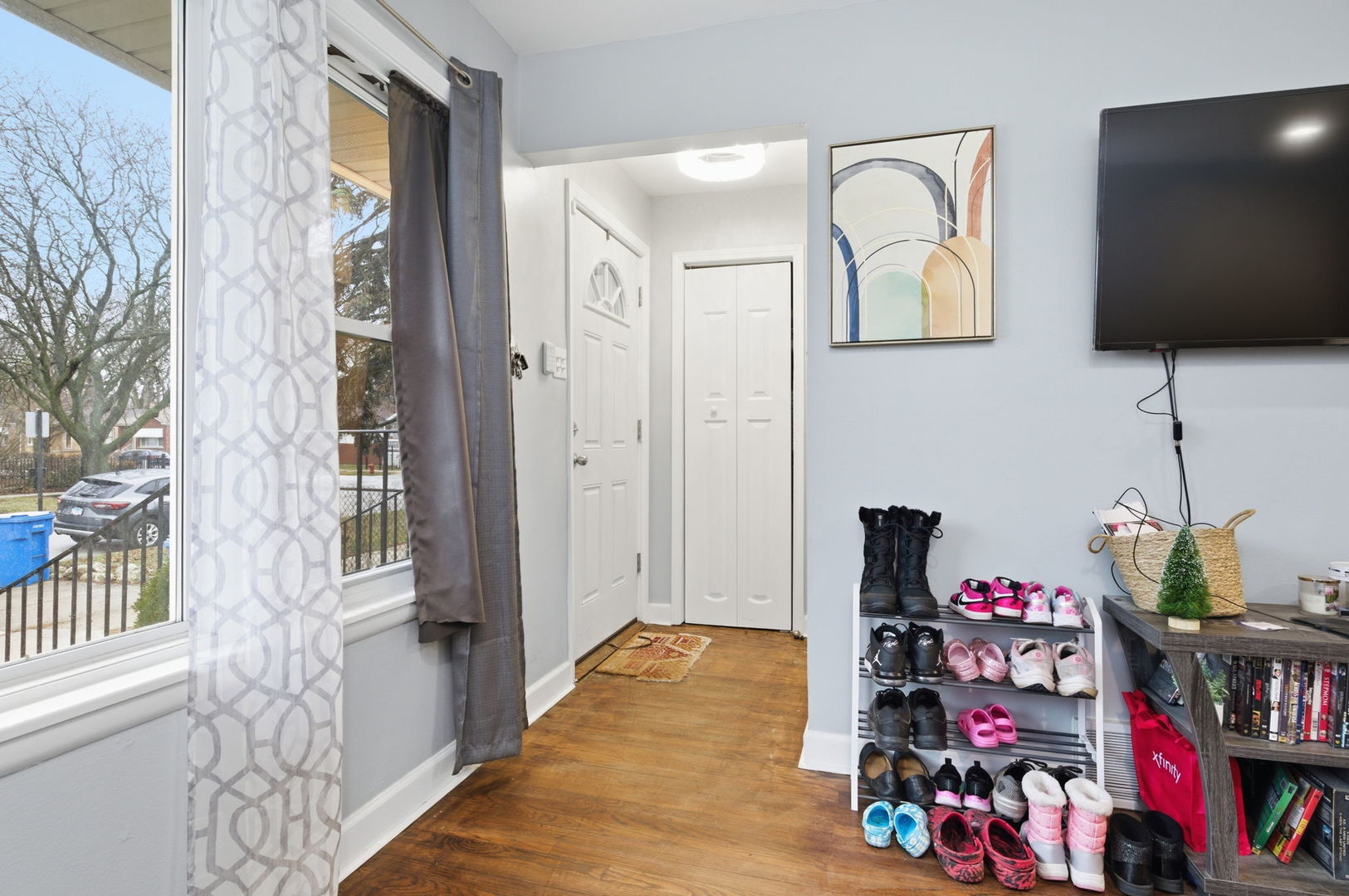 1036 West 105th Street Chicago, IL 60643 - Photo 3 of 30 a view of a entryway with wooden floor and furniture