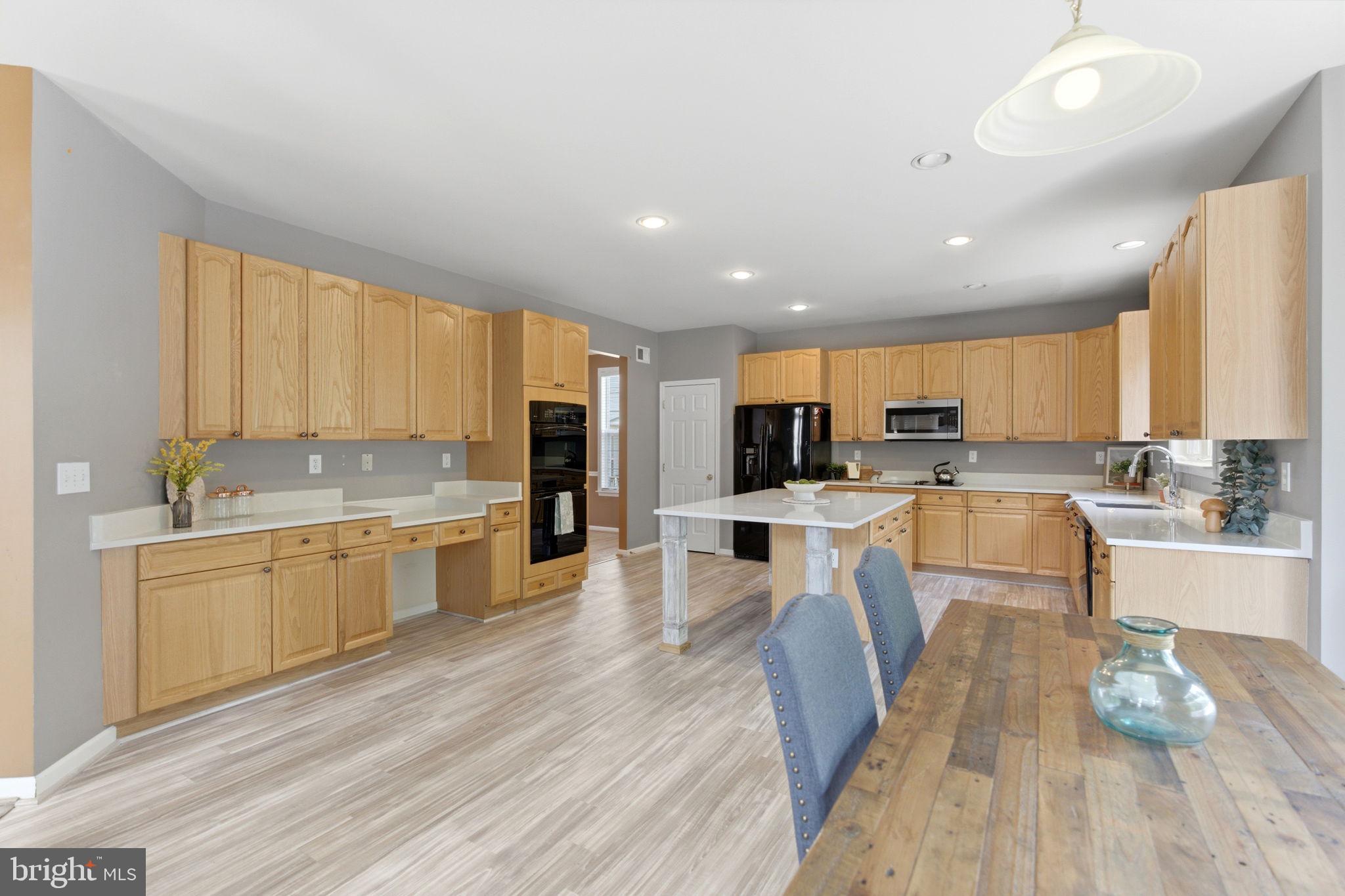 457 Hughs Road Charles Town, WV 25414 - Photo 14 of 73 Spacious kitchen with modern finishes.