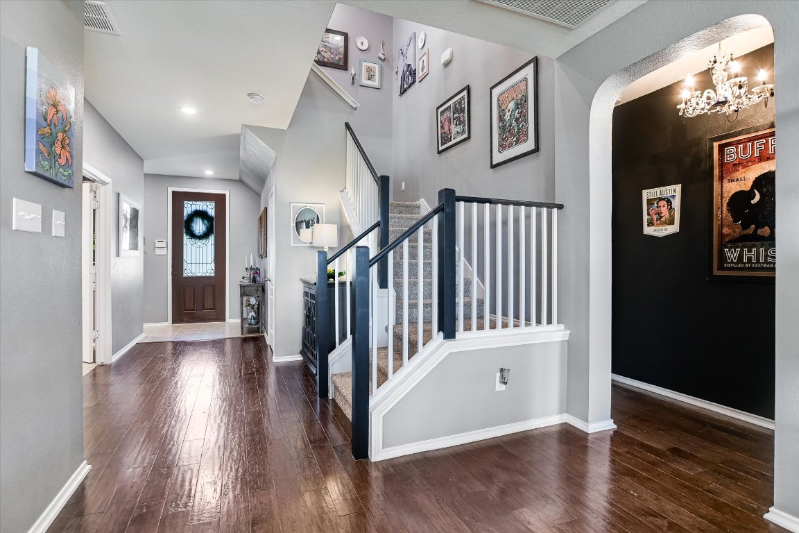 a view of entryway with stairs and wooden floor