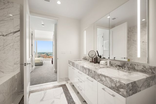 a en suite bathroom with a sink and a mirror
