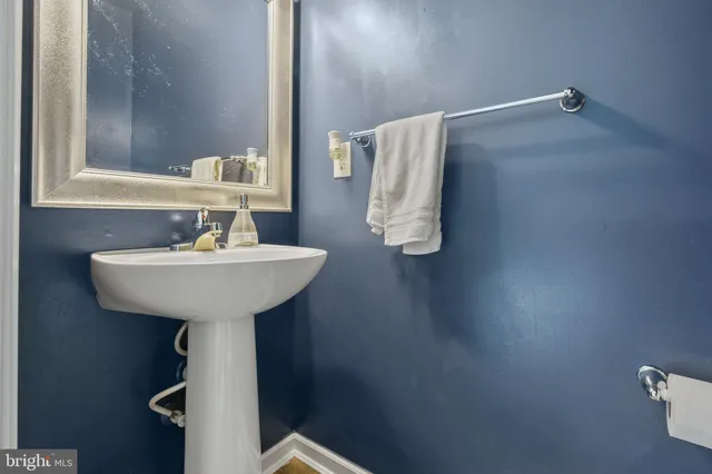 a bathroom with a sink and mirror