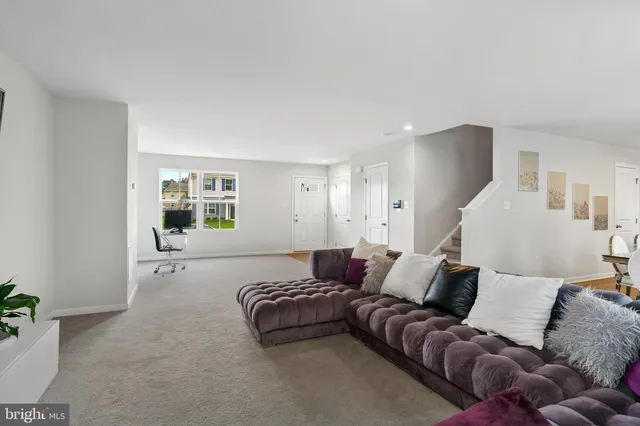 a spacious bedroom with a bed and couch