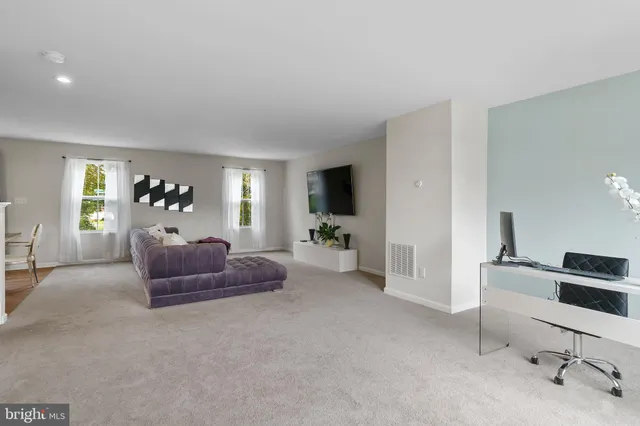 a living room with furniture and a couch