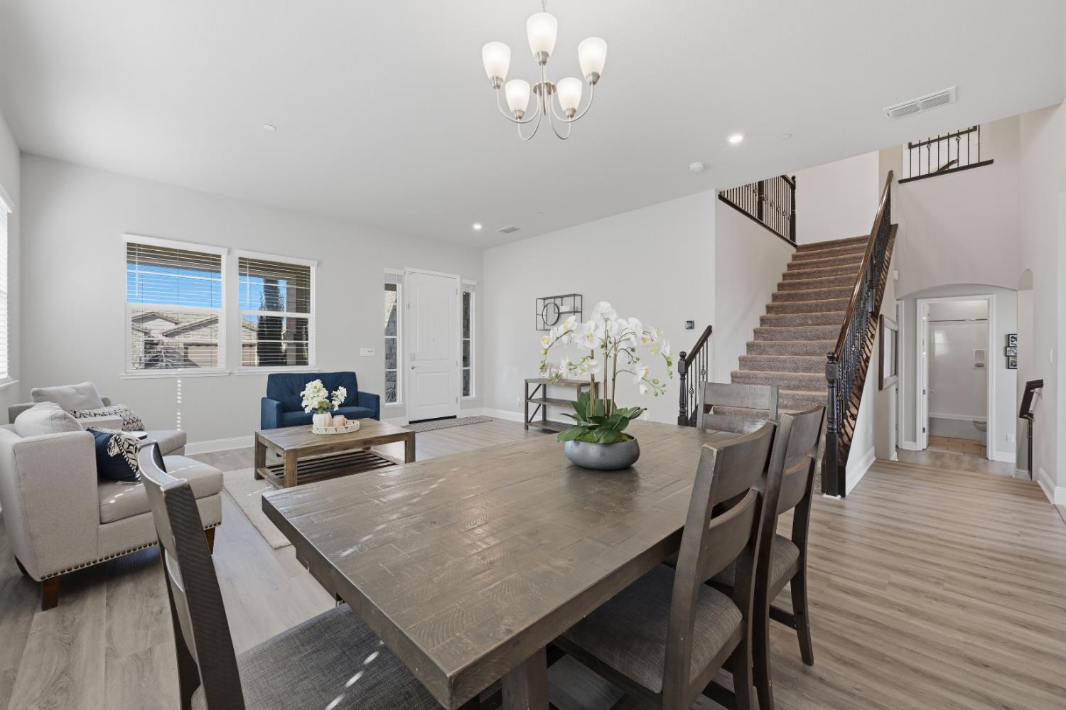 2012 Van Ruiten Drive Lodi, CA 95242 - Photo 7 of 49 a view of a dining room with furniture and wooden floor