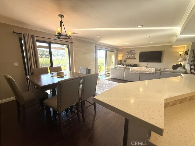 a view of a dining room with furniture and window