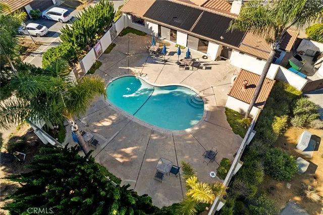 an aerial view of a house with outdoor space and a lake view
