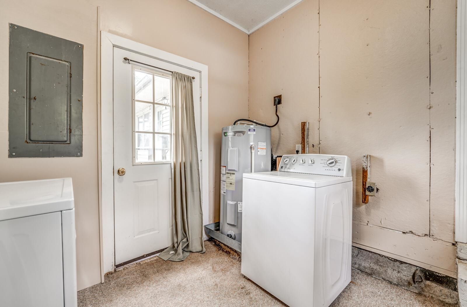 6125 Warren Road Oakland, TN 38060 - Photo 26 of 40 Utility area with light beige walls and light brown carpet flooring