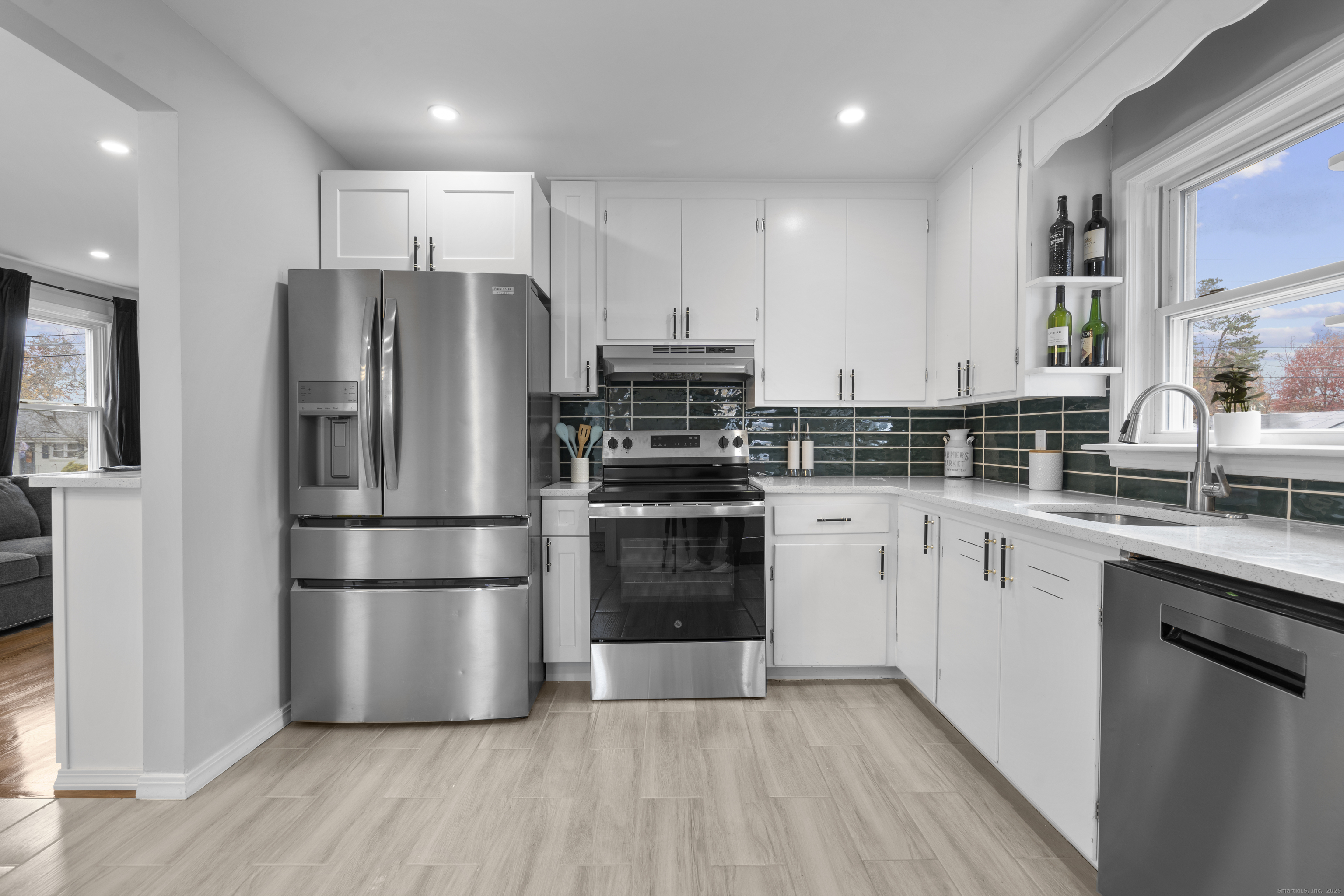 63 Irving Street Manchester, CT 06042 - Photo 12 of 39 a kitchen with stainless steel appliances a refrigerator sink and cabinets