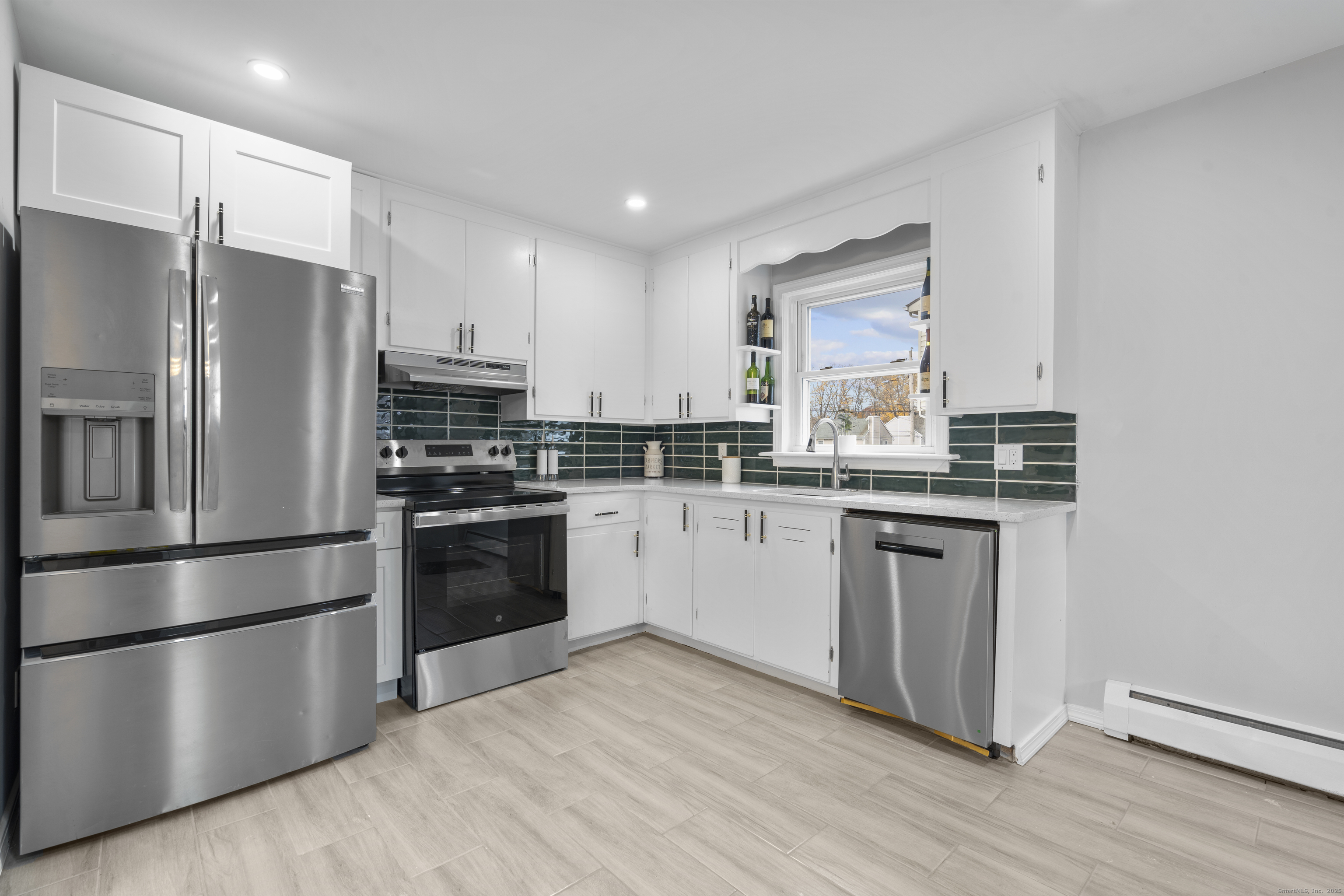 63 Irving Street Manchester, CT 06042 - Photo 13 of 39 a kitchen with stainless steel appliances a refrigerator sink and microwave