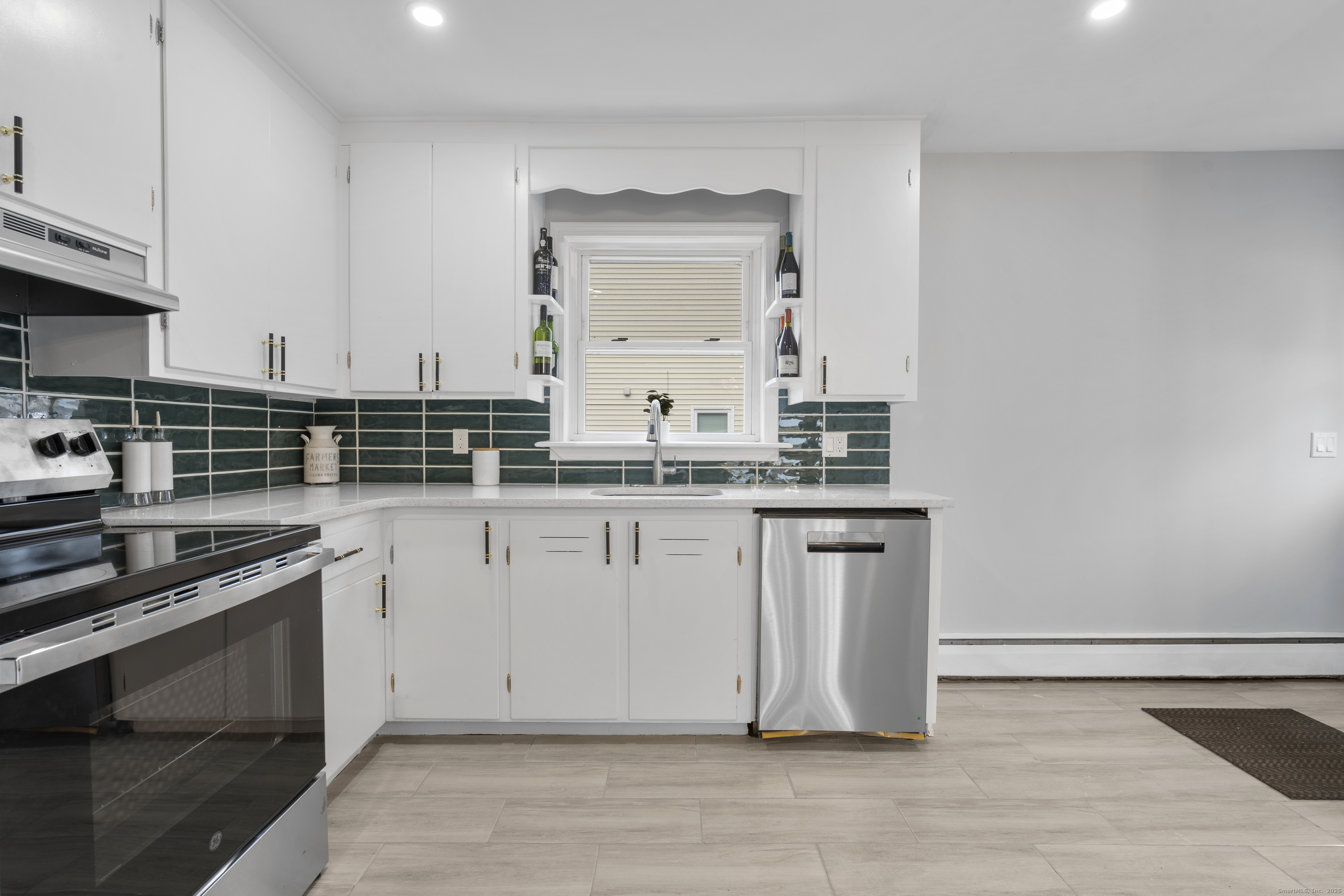 63 Irving Street Manchester, CT 06042 - Photo 14 of 39 a kitchen with stainless steel appliances granite countertop a sink stove and cabinets