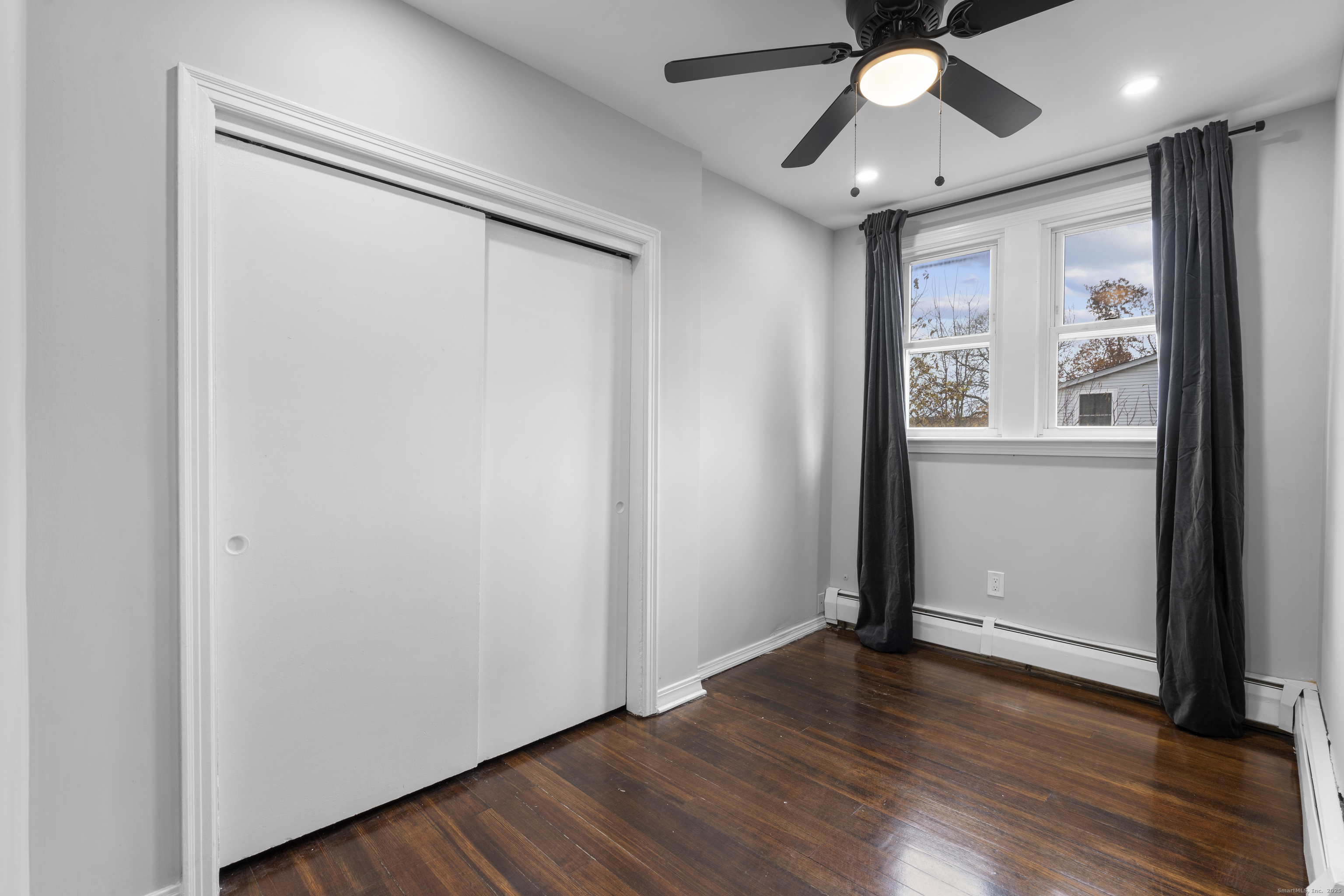 63 Irving Street Manchester, CT 06042 - Photo 22 of 39 wooden floor in an empty room with a window