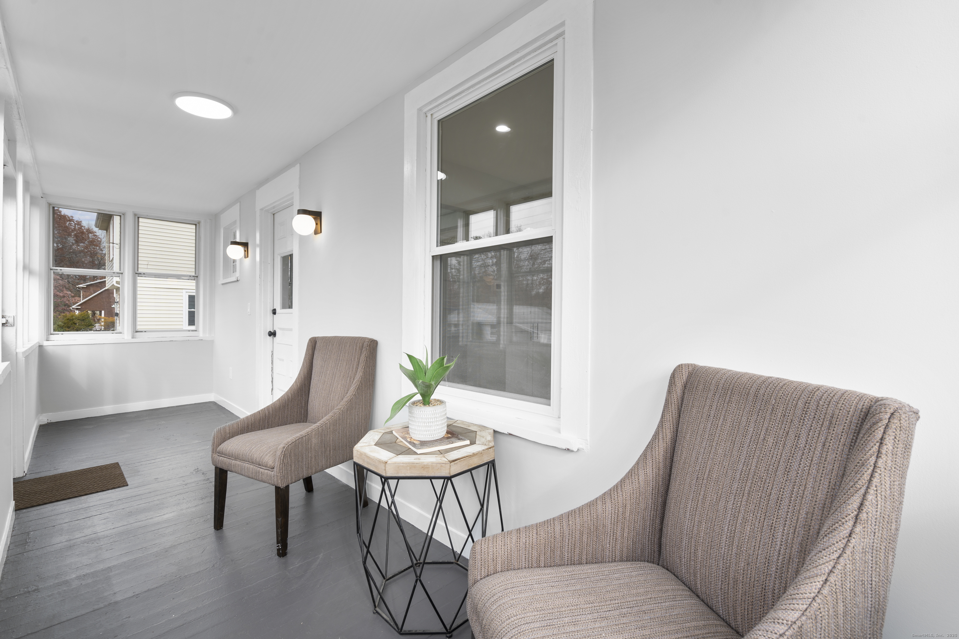 63 Irving Street Manchester, CT 06042 - Photo 3 of 39 a living room with furniture and wooden floor